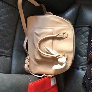 Two Levenger leather bags never used. The red tech case still in original box.